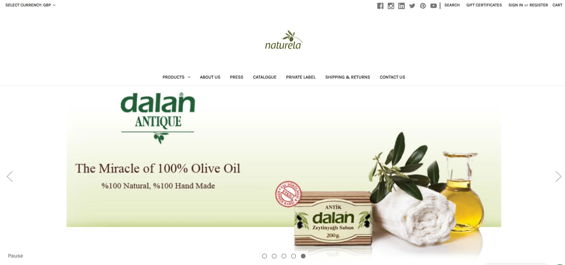 Dalan Antique soap displayed with olive oil and cloth. Text highlights 100% natural and handmade qualities.
